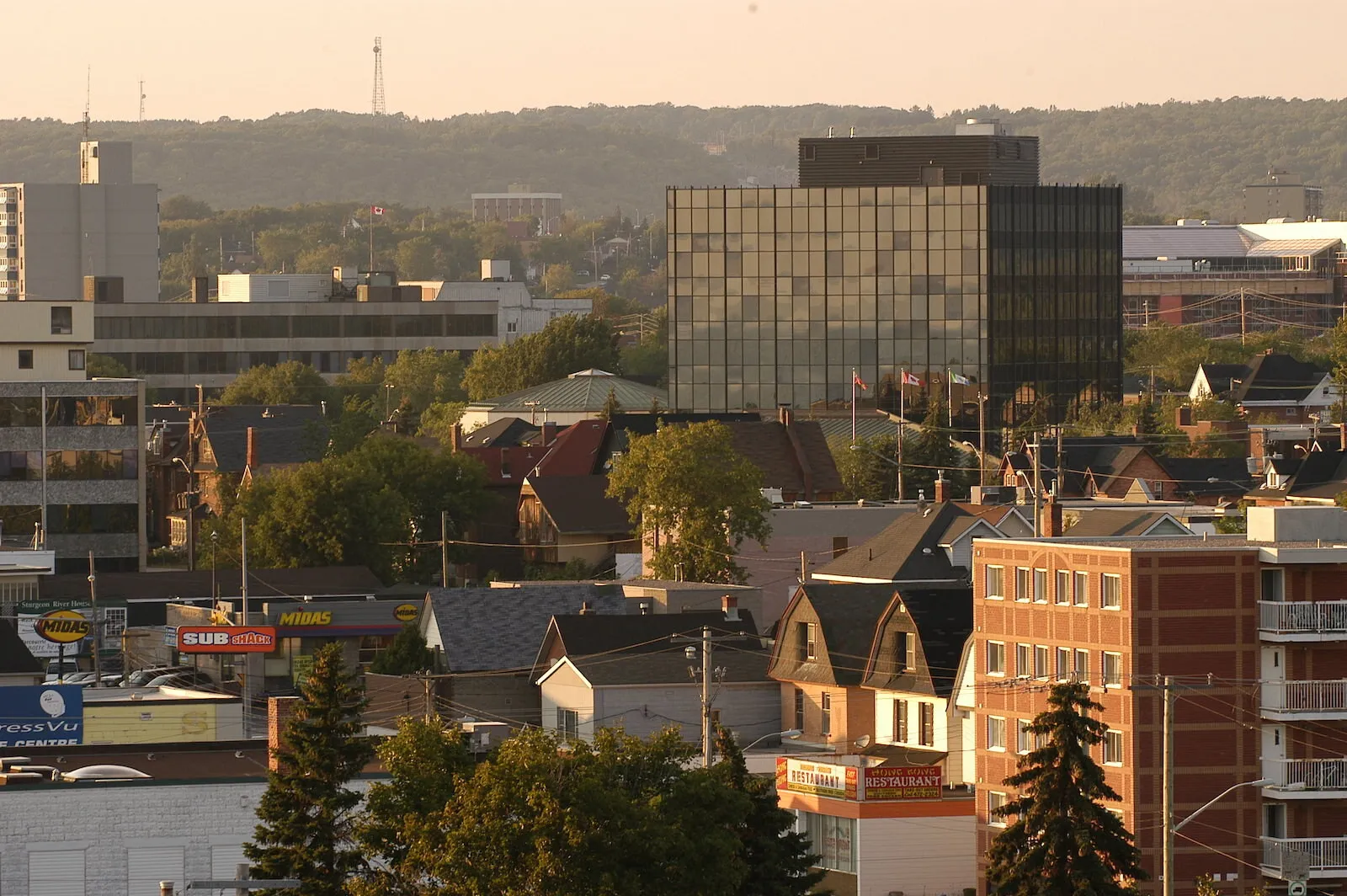 Downtown North Bay at golden hour, with City Hall rising above the rooftops