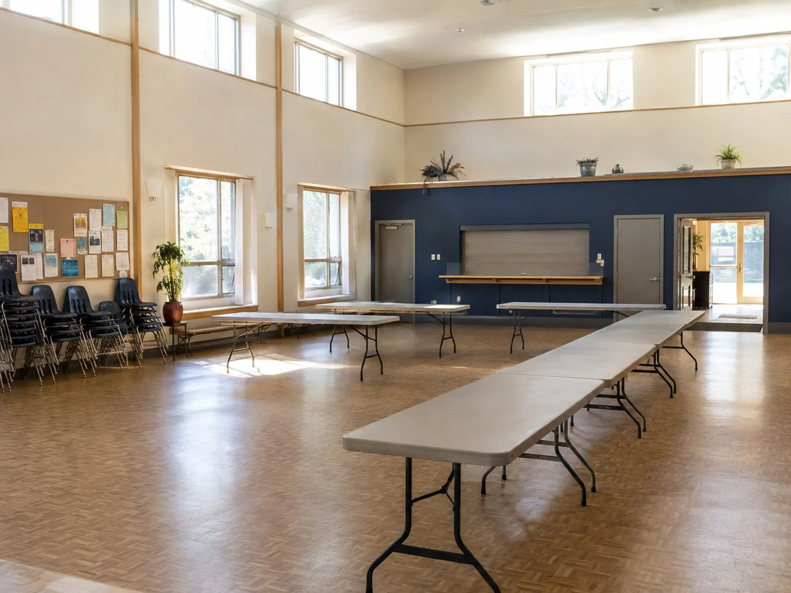 A bright, well-used community hall set up for a meeting